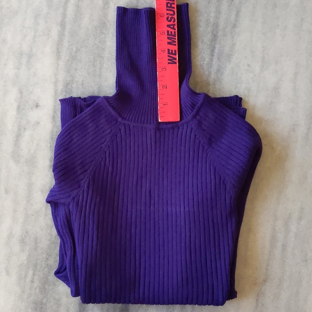 NWOT. Junior's stretch turtleneck sweater with buttons on sleeve.